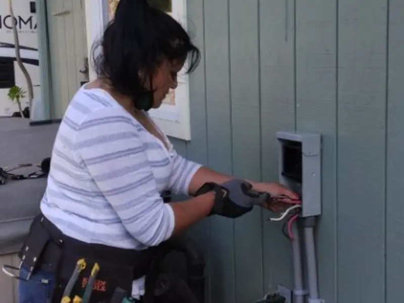 Licensed electrician wiring an exterior subpanel in Copperopolis