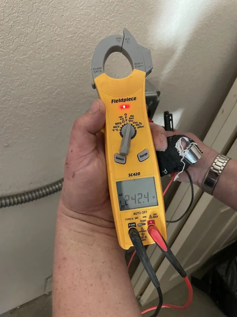 Voltage testing with clamp meter during Ceiling Fan Installation in Copperopolis